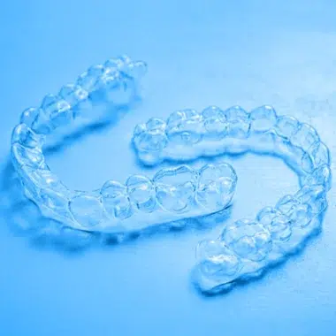 Clear retainers with blue background | Jordan Orthodontics Alpharetta, Georgia
