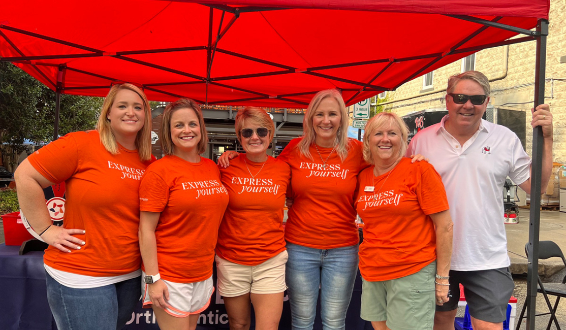 Dr. Jordan and clinical team members in the community at an outdoor event in Alpharetta, Georgia